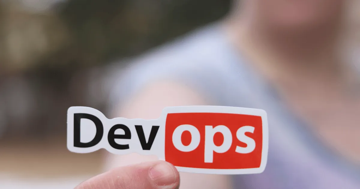 Man holding DevOps sticker